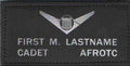 AFJROTC Black Leather Badges featuring silver winged shield insignia and personalized cadet name lettering