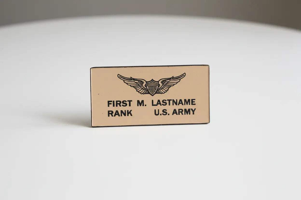 Custom US Army tan leather flight badges with personalized stamped text, matching pair for jackets