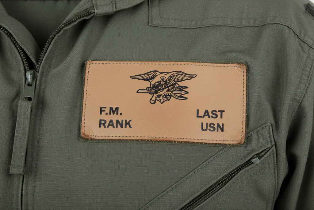 US Navy Tan Leather Badge over Left Breast on Green Flight Suit
